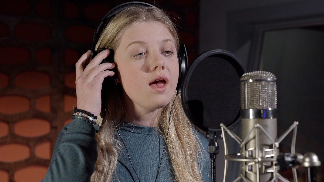 Phoebe at microphone