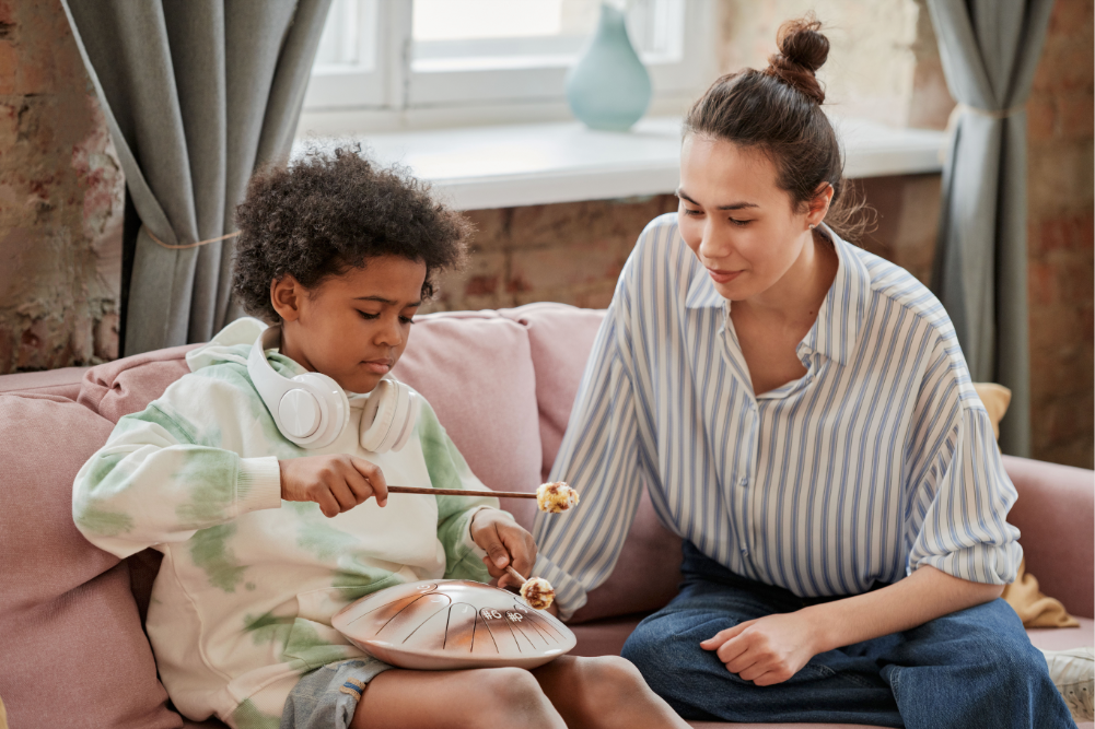 Music therapist works with a child for music therapy